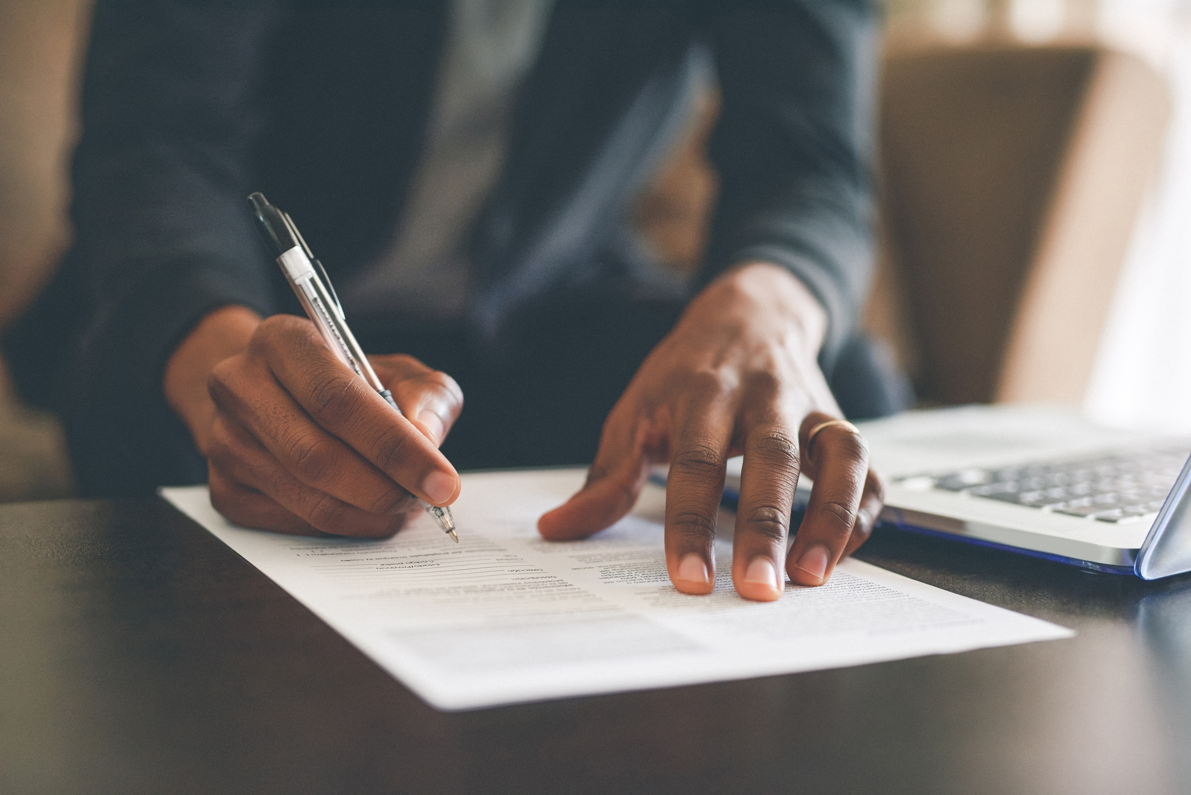 Man reviewing and verifying benefits form